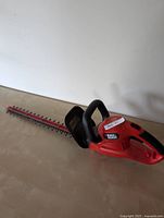 Full view of hedge trimmer showing body and blade