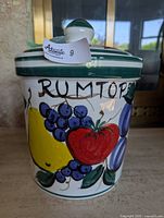 Front view showing Rumtopf lettering and fruit artwork