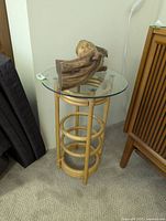 Side table with glass top and driftwood decor, full view