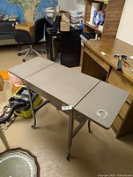 Perspective view with leaves extended, casters visible