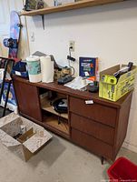 Full view of credenza with items on top and inside showing overall design and size