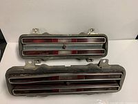 Both tail light assemblies front view showing lenses and housings