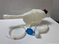 Full kit showing reservoir, filler neck, hose