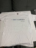 Full view of one T-shirt displaying front graphic text