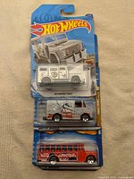 Front view of all three Hot Wheels vehicles in original blister packs
