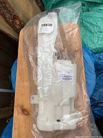 Full view of sealed washer reservoir in bag