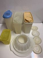 Front view of all containers, mold and inserts