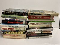 Two stacks of baseball books showing all spines, 20 volumes total.