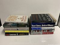 Two stacks of 10 fiction books, spines visible