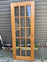 Full frontal view of the French door showing glass panes and handle hole