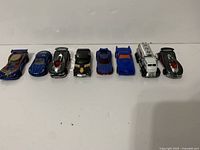Front view of all eight Hot Wheels cars lined up