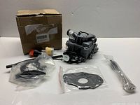 Carburetor with accessories and box