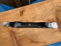 Full length view of 20 inch mower blade with ends wrapped