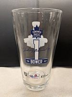 Front view showing Toronto Maple Leafs graphic, Johnny Bower signature, Molson logo