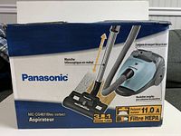Retail box showing Panasonic branding, model MC-CG467, product image, features