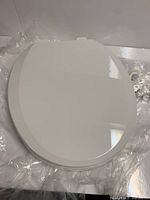 Top view of closed white toilet seat