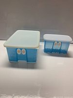 Front view of both FridgeSmart containers with lids on