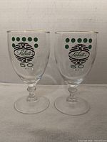 Two Labatt's 50 Ale gold-rimmed beer chalices side by side