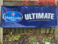 Full front view of Maple Lodge Farms Ultimate banner displayed outdoors