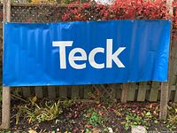 Front view of blue vinyl banner with Teck logo