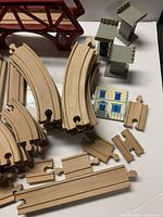 overview of curved and straight wooden track pieces, grey supports and building tile