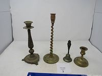 All four brass items side by side