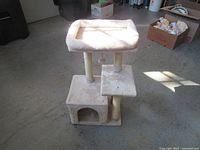 Full view of cat tree showing all tiers, condo, scratching posts and hanging toy