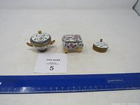 All three trinket boxes with ruler for scale