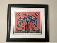 Frontal view of framed Norval Morrisseau print