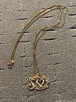 Full view of necklace showing chain and pendant