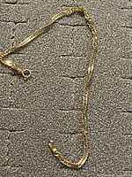 Full view of the gold curb chain bracelet