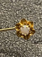 Close-up of floral head with opal stone