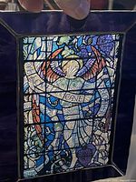 front view of stained glass panel showing full design