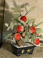 Full view of gemstone bonsai peach tree in planter