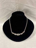 Full view of necklace on display form