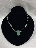 Full view of jade and sterling necklace on bust