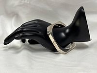 Full view of sterling square bangle on display hand