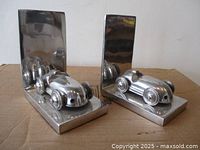Pair of aluminum race car bookends angled front view