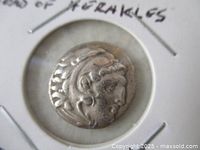 Front view of silver drachm showing head of Heracles