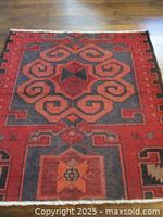 Full view of rug showing design and colors
