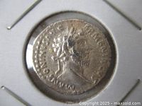 Obverse of the Antoninus Pius silver denarius in holder