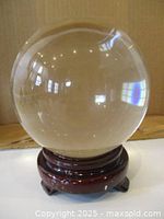 Crystal ball on wooden stand