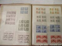 Album pages showing assorted Canadian stamp blocks from 1960s-1970s