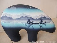 Left side view of bear figurine showing full painted scenery