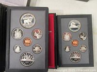 Both proof sets open showing all coins