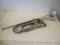 Full side view of silver-plated bugle
