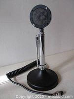 Full view of Astatic D104 microphone on base with coiled cord