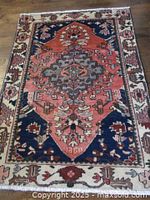 Full view of Persian Saveh rug showing pattern and colors