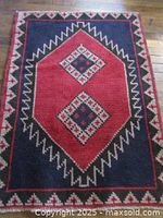 Full view of red and navy Persian Fasa rug
