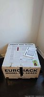 Closed original box showing Eurorack Model MX3242X labeling